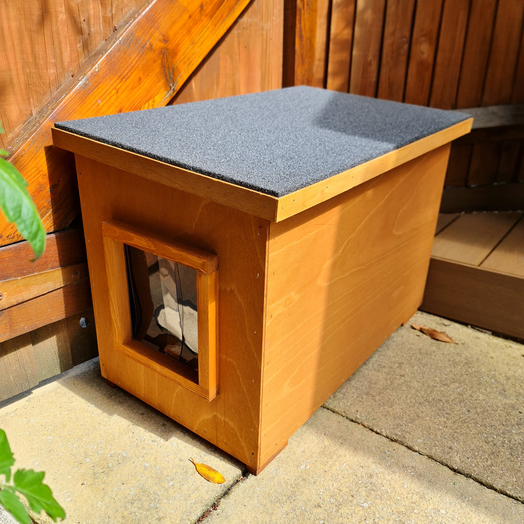 Tall cat house with elevated design and spacious interior